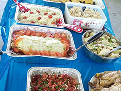 A lot of traditional food on the table.