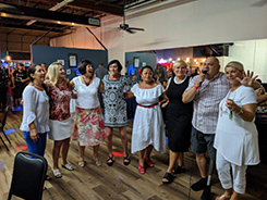 Singing on the floor and enjoying the party.